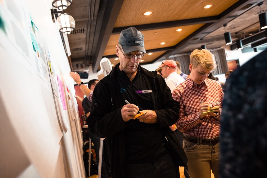 Brainstorming and interaction between participants is a key part of the design-thinking process. (Photo/Jim Gordon)
