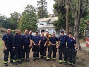 Dickson (yellow jacket) poses with members during a training exercise.