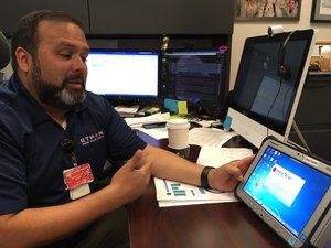 Dr. Michael Gonzalez demonstrates the software that manages the Houston Fire Department’s ETHAN telemedicine program.