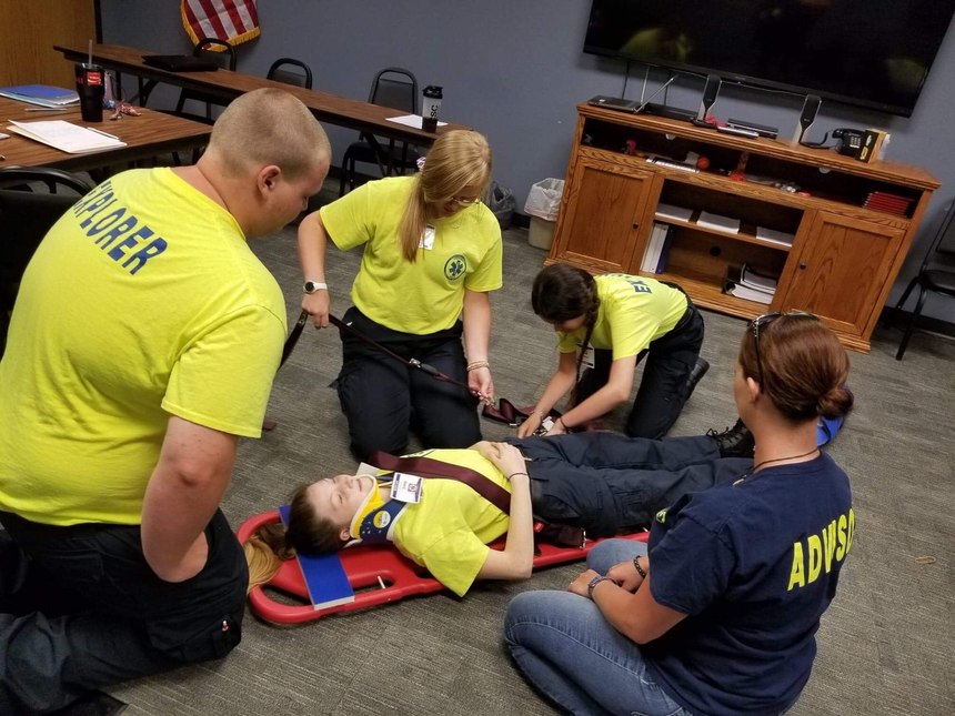 Lead Advisor and Paramedic Katy Deener (right) with Explorers during splinting training. (Photo/Katy Deener, Audrain Ambulance District)