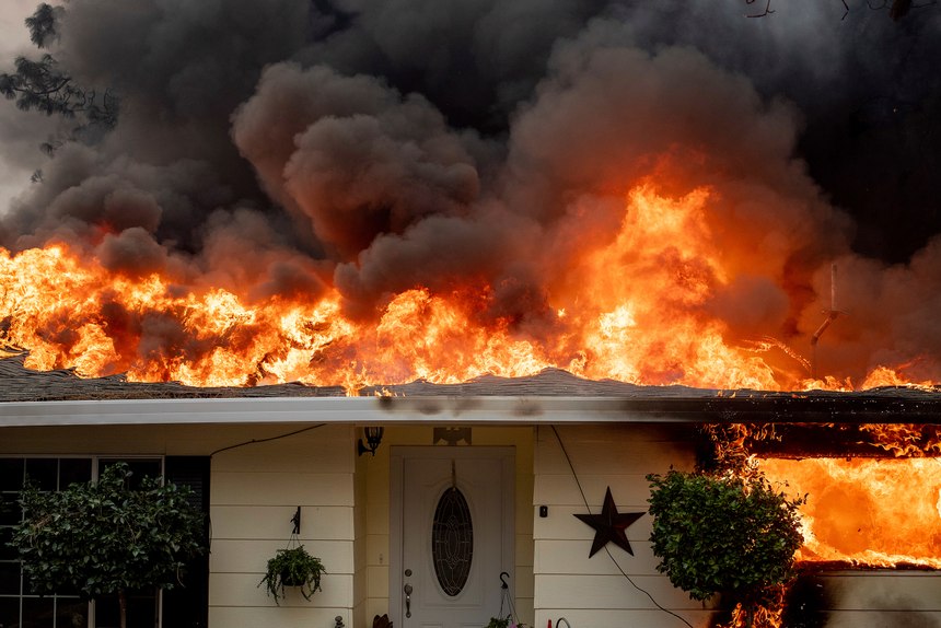 Flames consume a home as the Camp Fire tears through Paradise, Calif., on Thursday, Nov. 8, 2018. (AP Photo/Noah Berger, File)