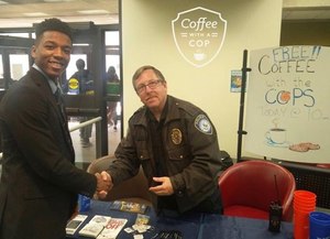 University of Akron police Captain Allan Grad interacting with a student at Bierce Library during Coffee With A Cop. (Photo/Jim Gilbride)
