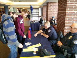 University of Akron Police Major Dale Gooding and Lieutenant Ken Rayl interacting with students at the Student Union. (Photo/Jim Gilbride)