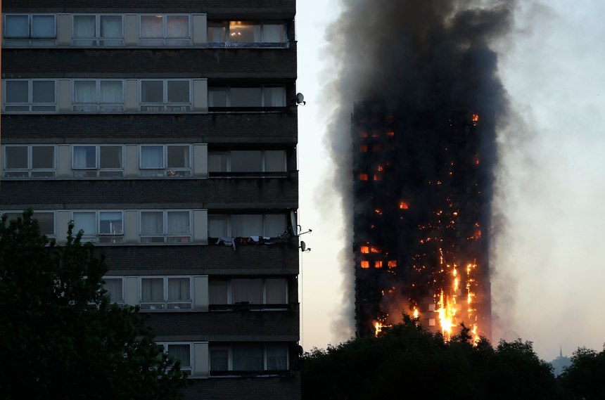 Smoke and flames rise from the Grenfell Tower in London in June 2017.
