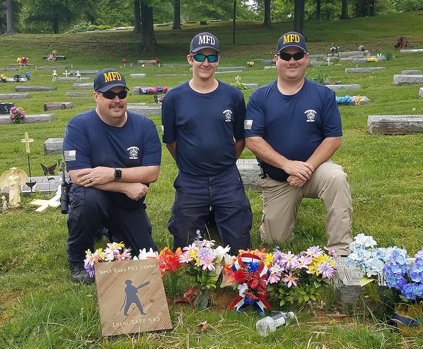 Assistant Chief Kevin Kimple, firefighter Brady Clarke (Noel’s son), Chief Gary Brandon at Chief Clarke's grave