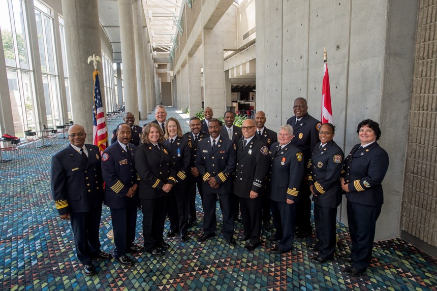 Co-leads Chief John Butler (far left) and Chief Laurie Vandeshoot (far right) pose with members of the second iDELP cohort (2019-2021), which kicked off in August 2019 at the IAFC’s Fire-Rescue International conference.