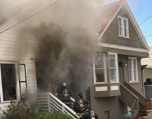 Here, the aggressive engine company is mounting an offensive interior attack in the living area of this residential structure.