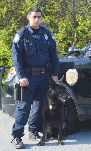Officer Gomez is pictured here with Hacker, his German shepherd partner, who is not only a police K9, but also a comfort dog.