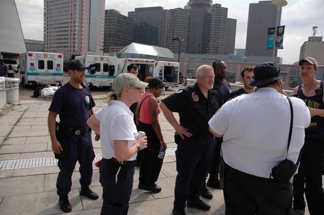 New Orleans Emergency Medical Service (formerly known as the New Orleans Health Department) professionals gather for a daily briefing. Crews, equipment, and vehicles were elevated to higher ground while waiting for flood waters from the breached levees to recede. (Photo/Miles Jeffery Watts, Jr.)