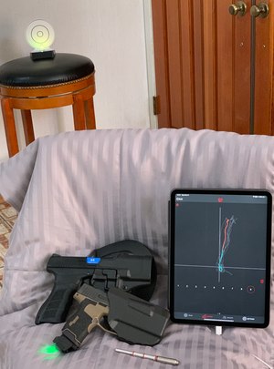 Clockwise from top left, i-MTTS target, iPad with MantisX draw analysis showing a mostly consistent draw, Laser-Ammo SureStrike universal dry-fire cartridge, SIG P365 with Mantis X10 on a magazine base mount, and a KWA ATP with a Laser-Ammo Recoil Enabled AirSoft Laser conversion kit.