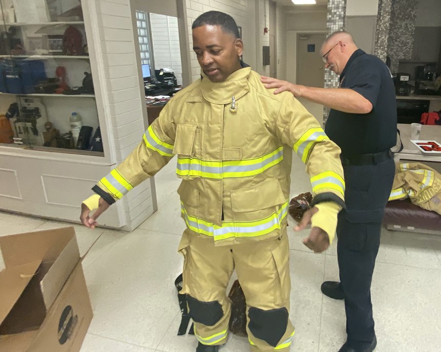 A fire captain oversees the delivery and fitting of each set of bunker gear and is present to provide guidance on its proper use and maintenance.
