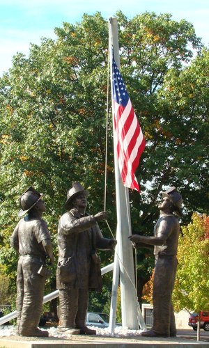 A bronze monument, named “To Lift a Nation,” recreates the famous photo taken by Thomas E. Franklin, a photographer for the Bergen Record, who captured the image of three firefighters raising the American flag at Ground Zero.