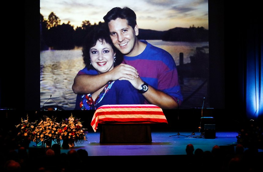 A family photo during a video montage of Ventura County Sheriff Sgt. Ron Helus with his wife Karen years ago. (Al Seib /Los Angeles Times via AP, Pool)