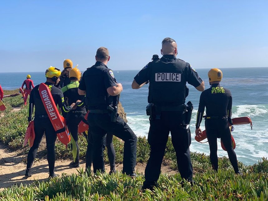 Santa Cruz police officers look out over a cliff where a suspect drove off it and into the ocean on June 30, 2020. (Photo/Santa Cruz Police Department)