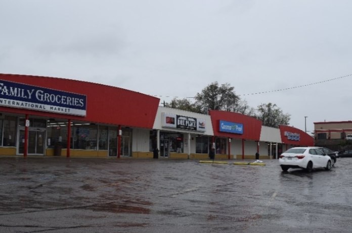 Figure 3 shows a typical strip mall interior with a parapet and awning walkway cover. Note this complex was built around 1965 and has changed major retail occupancies many times, once being the home office and lead retail store for a major regional chain of hardware stores.