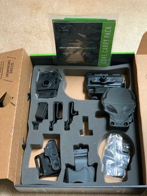 The Alien Gear ShapeShift Core Carry Pack comes with parts that can be used to customize how you carry your firearm.
