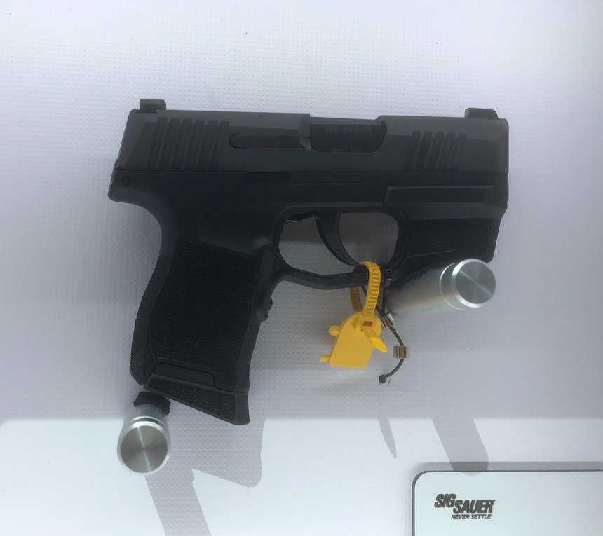 SIG’s LIMA365 is a red laser that mounts to the equipment rail on the P365. Activation is via a pressure switch on the frontstrap of the gun.