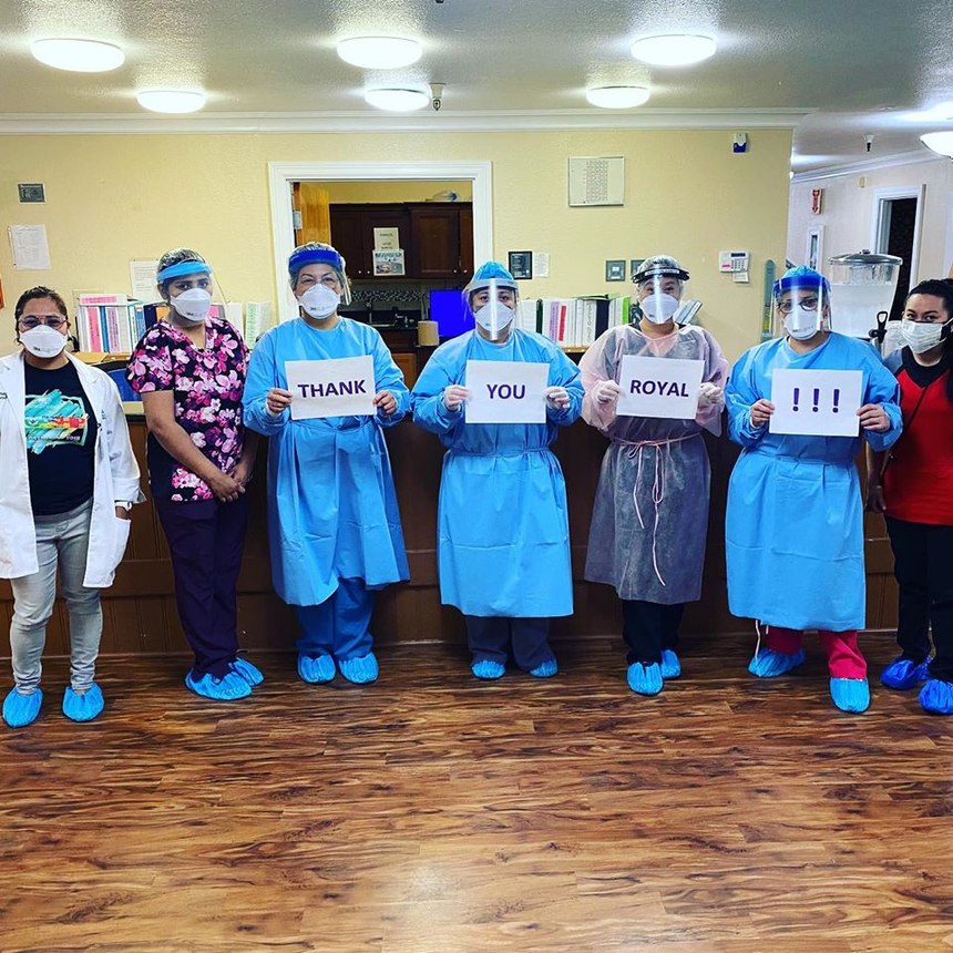 Skilled nursing facility personnel show their appreciation for Royal Ambulance EMTs who joined their staff to assist during the COVID-19 pandemic.