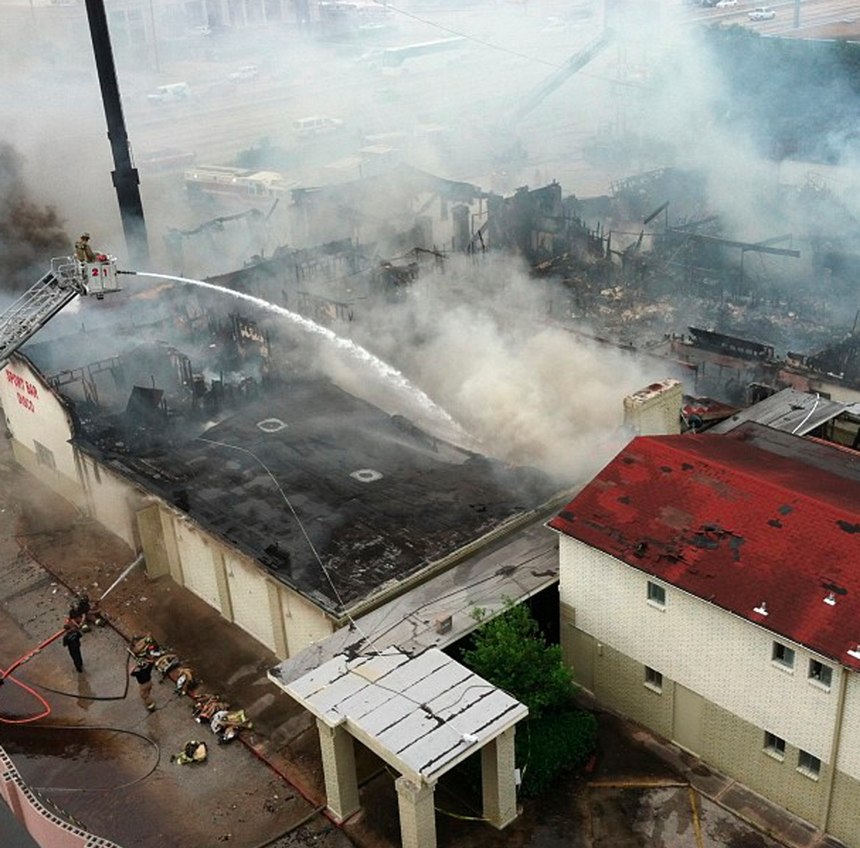 Firefighters battle a blaze at the Southwest Inn, Friday, May 31, 2013, in Houston.