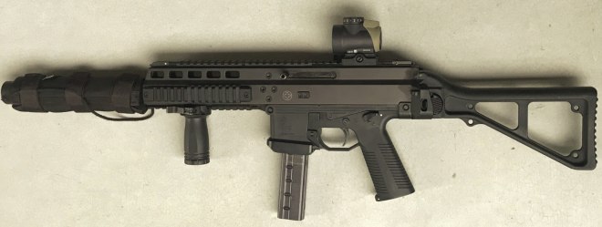 The Suppressed B&T APC-9 Suomi with a Trijicon MRO in a Spuhr mount and cover.