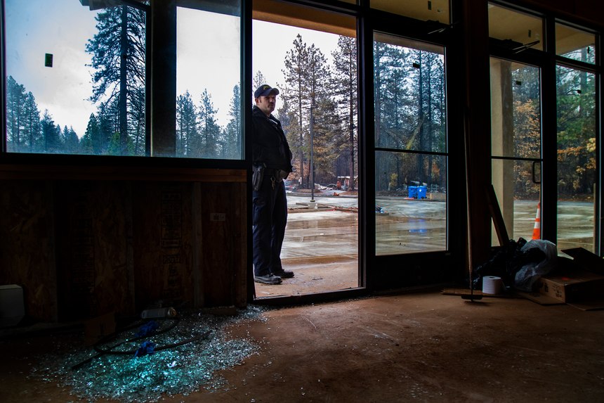 Paradise Police Officer Perry Walters returns to the scene 19 days later where he and other officers smashed the glass doors of this business to shelter several hundred people as the fire moved closer and the air grew unbearably smoky and hot on Nov. 27, 2018 in Paradise, Calif. They hunkered there for 4 hours. (Gina Ferazzi/Los AngelesTimes/TNS)