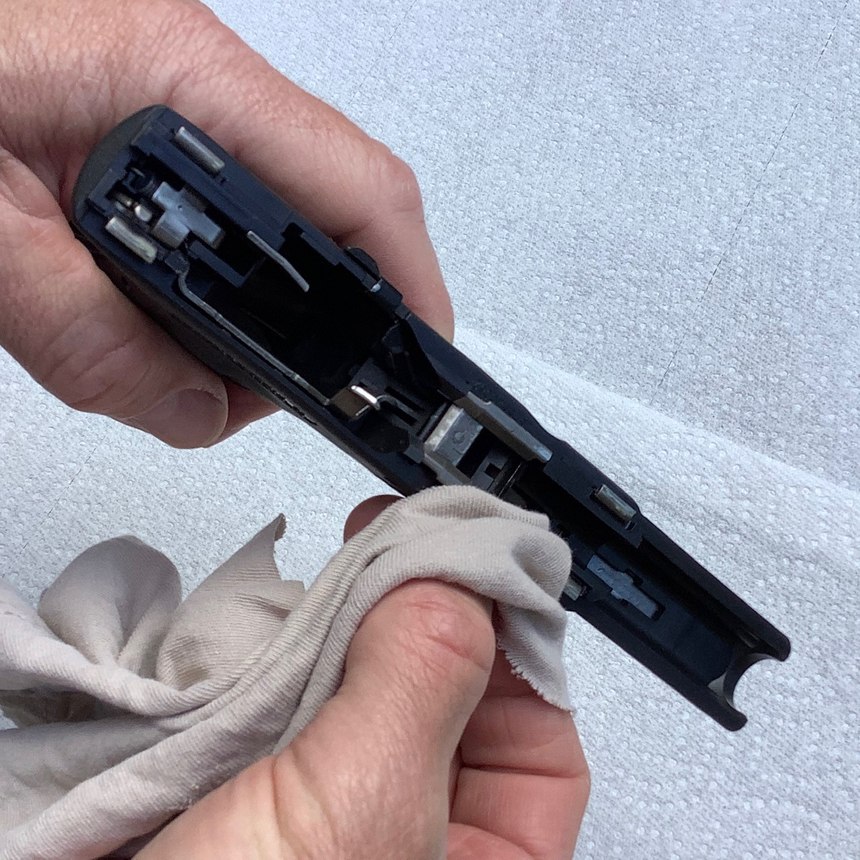Clean the locking block area and the forward rails with your rag to get them clean and dry.