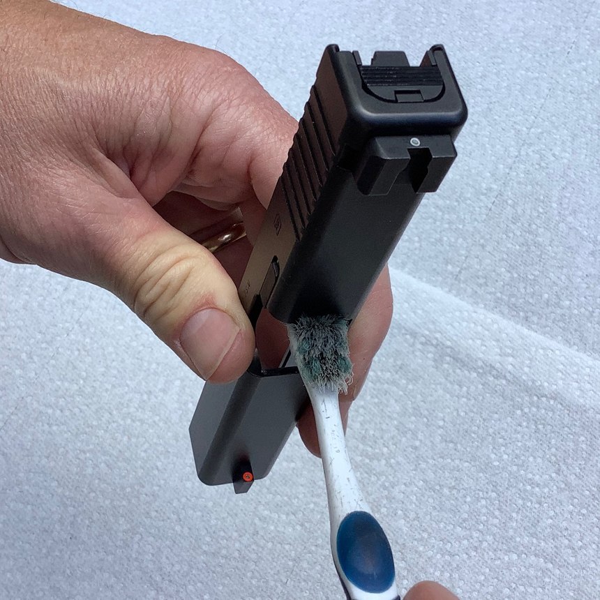 If you need to scrub the breech face to get it clean, do it with the muzzle facing down, to limit the amount of runoff into the slide’s internals.