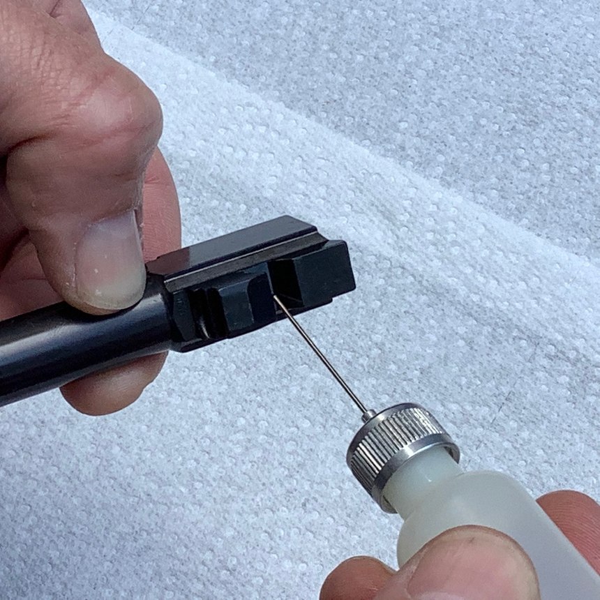 A small drop of oil on the locking lug is appropriate too. Smear it on the lug with your finger to distribute.