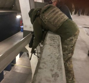 Multi-tiered facilities present unique challenges for police snipers and force some awkward shooting positions.