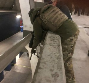 Multi-tiered facilities present unique challenges for police snipers and force some awkward shooting positions.