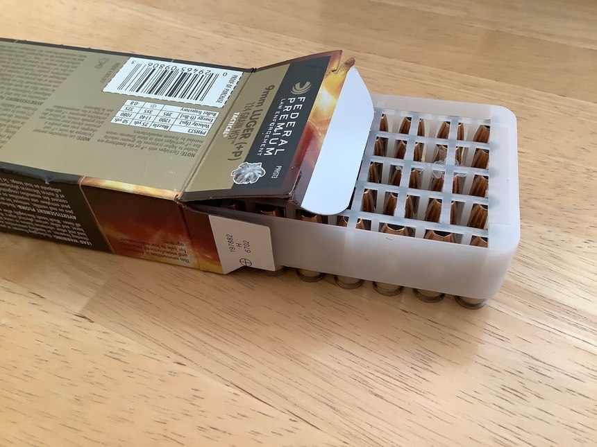 After the top side inspection is complete, turn the box upside down and carefully remove the tray to stack the cartridges upright for another look.