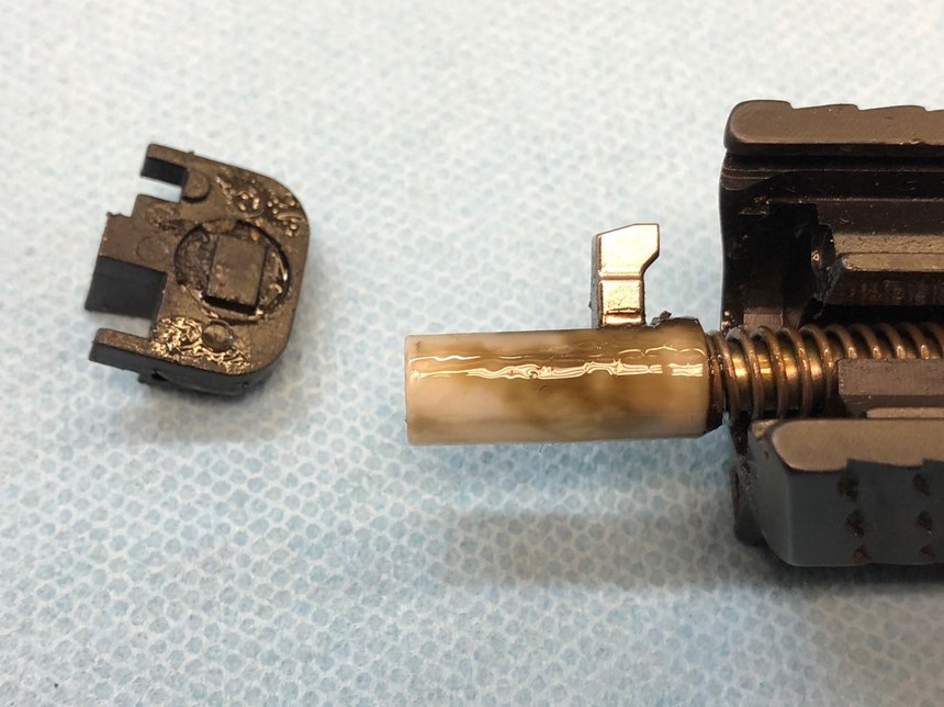 The sticky mess on the striker of this Smith & Wesson M&P pistol prevented it from working properly.