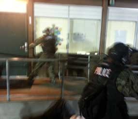 SWAT officers approach Palomares Elementary School in Castro Valley during an active shooter drill at Urban Shield 2013.