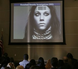 In this Tuesday, Jan. 12, 2016 photo, members of the industry group Club Owners Against Sex Trafficking attend a presentation by a U.S. Department of Homeland Security agent teaching owners of strip clubs and strippers how to spot sex traffickers, at the Burbank Community Services Building in Burbank, Calif. (AP Photo/Damian Dovarganes)