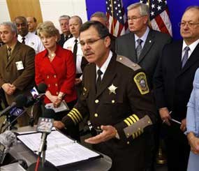 Stafford County Sheriff, Charles Jett gestures during a press conference at the Capitol in Richmond, Va., Wednesday, Jan. 27, 2010. Sheriffs, police chiefs and other law enforcement officials say proposed budget cuts could devastate their ranks, reducing the safety of both officers and the public.