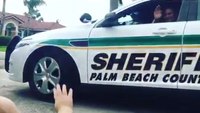 Baby waves to Fla. cop dad