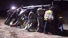 Calif. responders hoist car, freeing trapped woman 