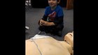 Child trains with AED 