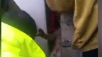 Firefighters rescue dog wedged between walls