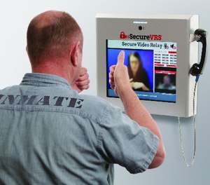 An inmate using secured video relay.