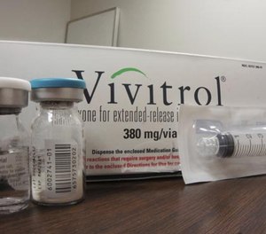 This Oct. 19, 2016 photo taken at Family Guidance Center, an addiction treatment center in Joliet, Ill, shows the packaging of Vivitrol, a high-priced monthly injection used to prevent relapse in opioid abusers.