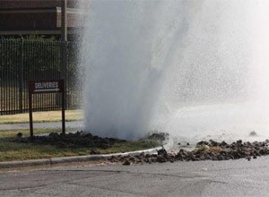 A major water main break caused water to shoot about 40 feet into the air around 9:15 a.m. Thursday near S.E. 9th and Jefferson on the south side of the Shawnee County Jail. (Photo Phil Anderson/The Capital-Journal)