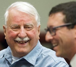 Jack McCullough, left, smiles in court with attorney Russell Ainsworth of the Exoneration Project, Thursday, April 6, 2017, at the DeKalb County Courthouse in Sycamore, Ill. (Matthew Apgar/Daily Chronicle via AP, Pool)