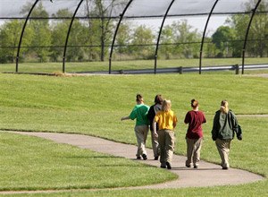 Unidentified youthful offenders at Scioto Juvenile Correctional Facility walk around the track during recreation time Tuesday, May 12, 2009, in Columbus, Ohio.